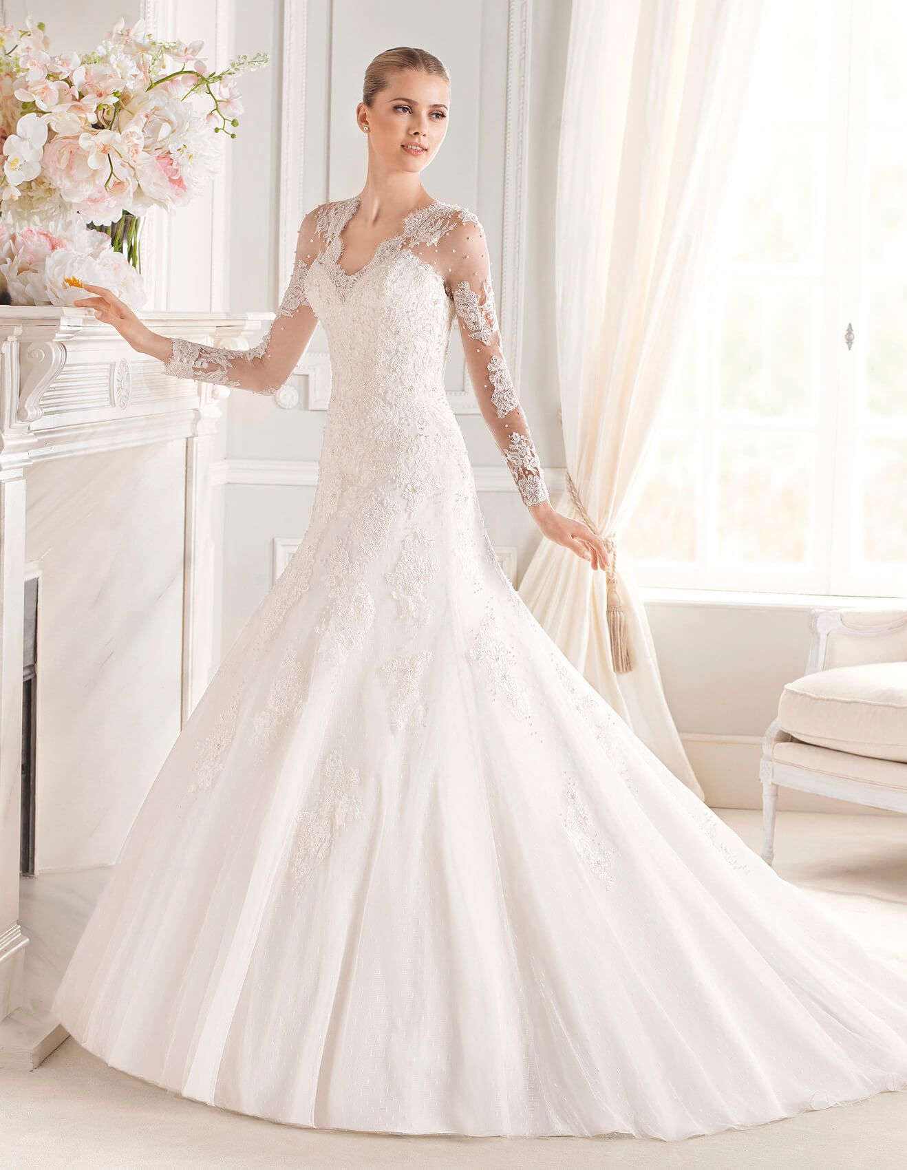 Suknie ślubne Koronkowa suknia ślubna z długim rękawem i efektowną koronką