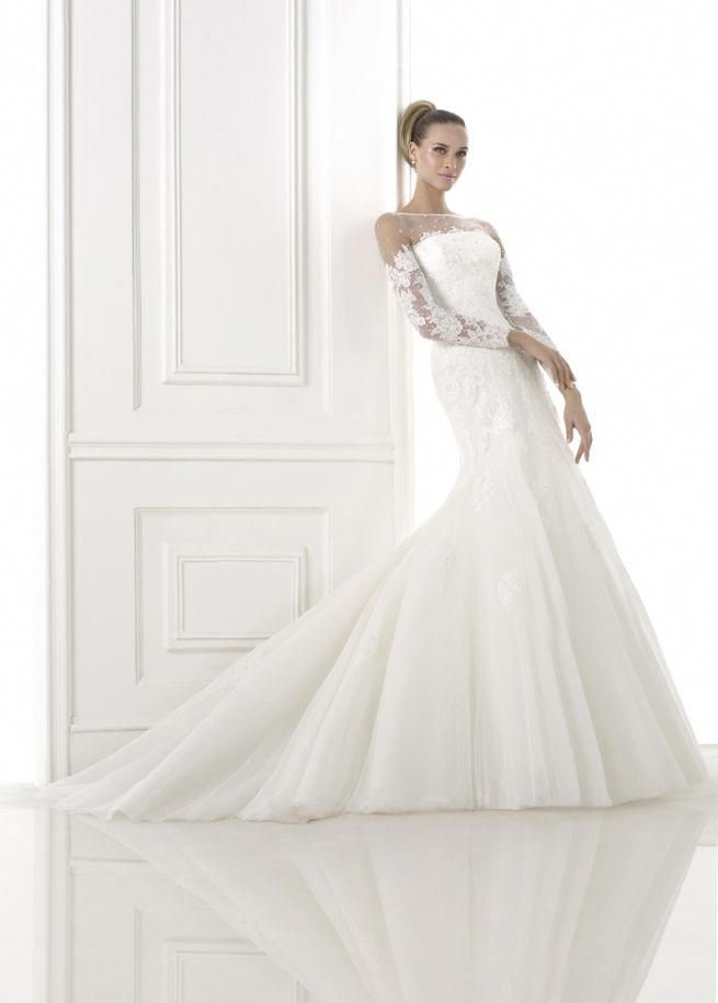 Suknie ślubne Dopasowana suknia ślubna z długim rękawem i koronkowym zdobieniu